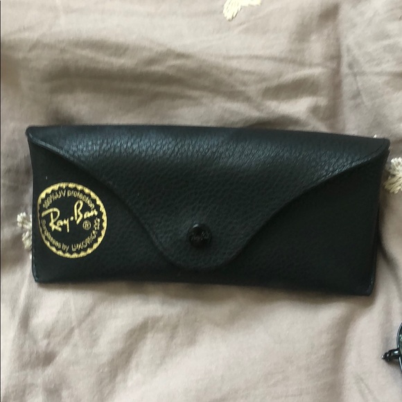 brand new pair of black Ray Ban sunglasses
